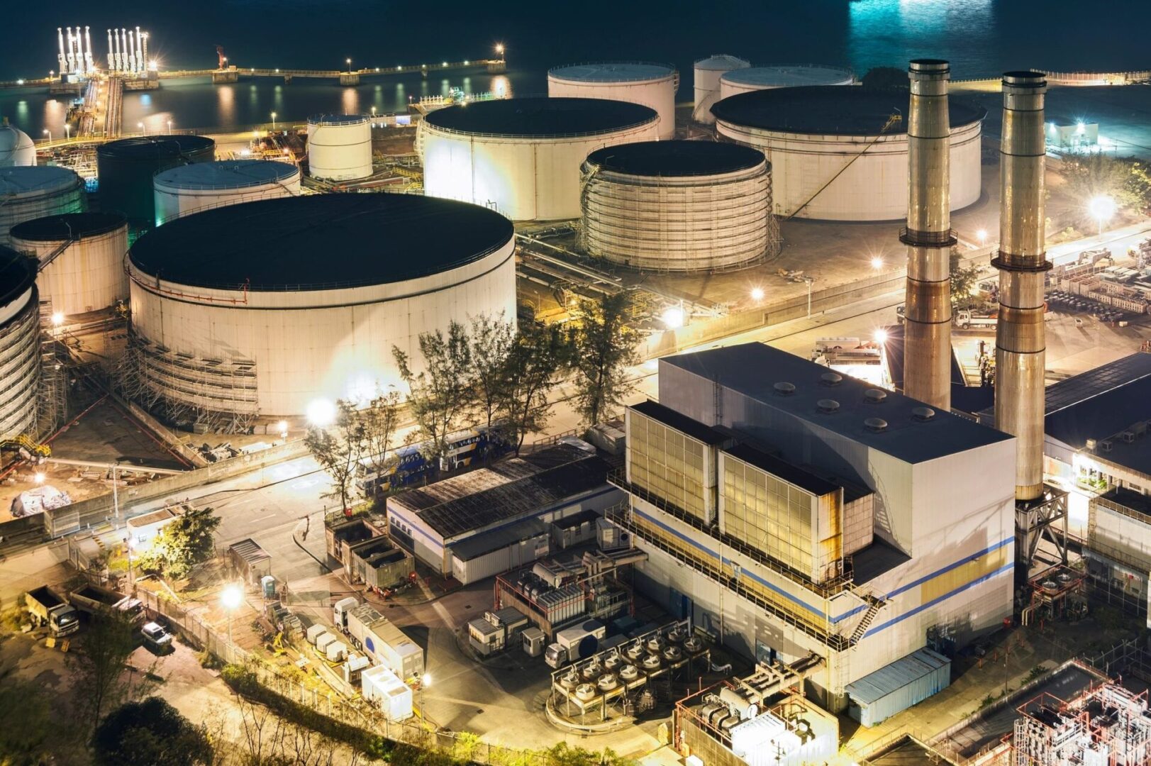 A large industrial area with many tanks and buildings.